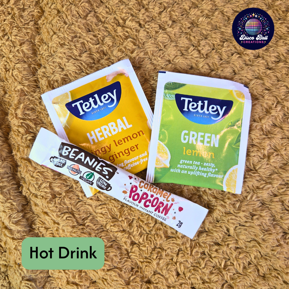 Two tea packets and one coffee packet on a textured surface with 'Hot Drink' label.