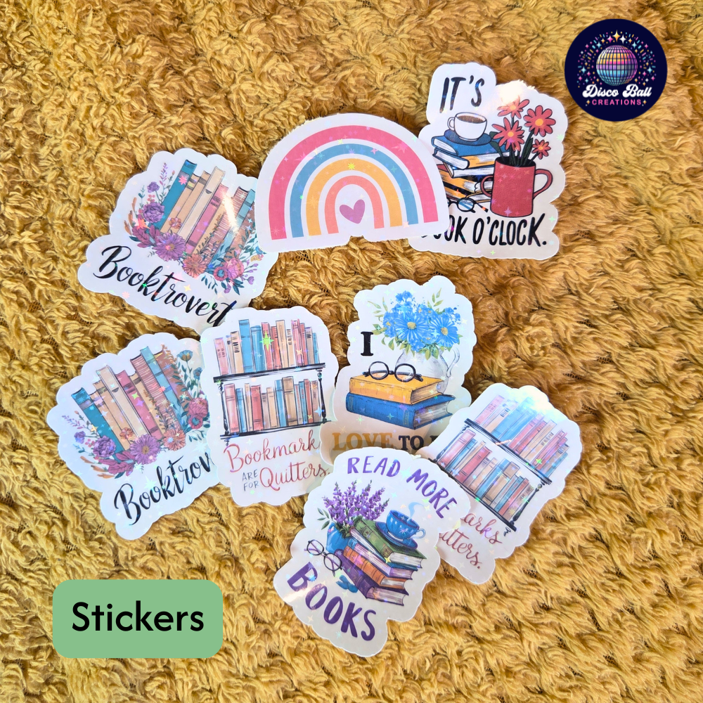 Set of book-themed stickers on a textured surface